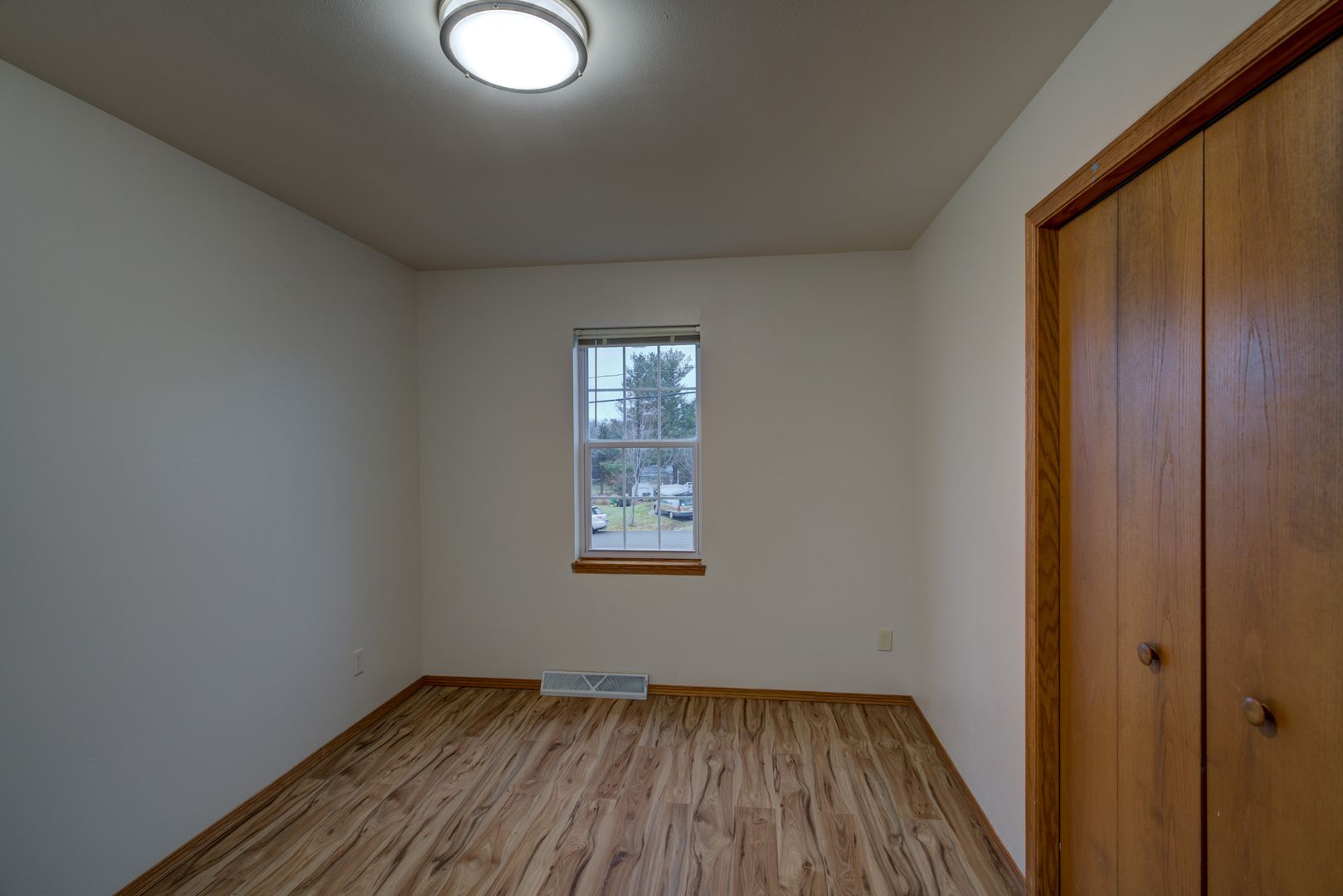 Dark apartment before professional property manager photo editing - poor lighting and unappealing appearance