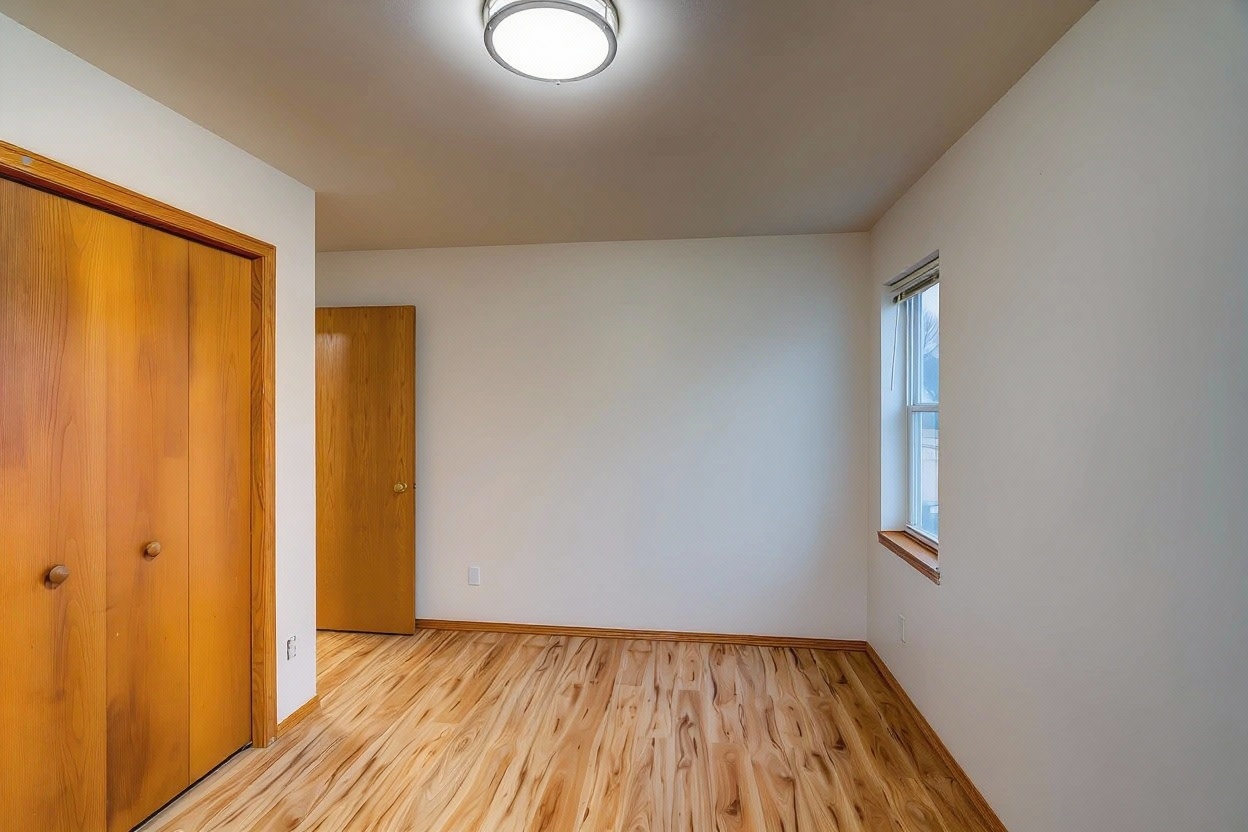 Bright Airbnb bedroom after professional photo editing - enhanced lighting and appealing appearance for more bookings